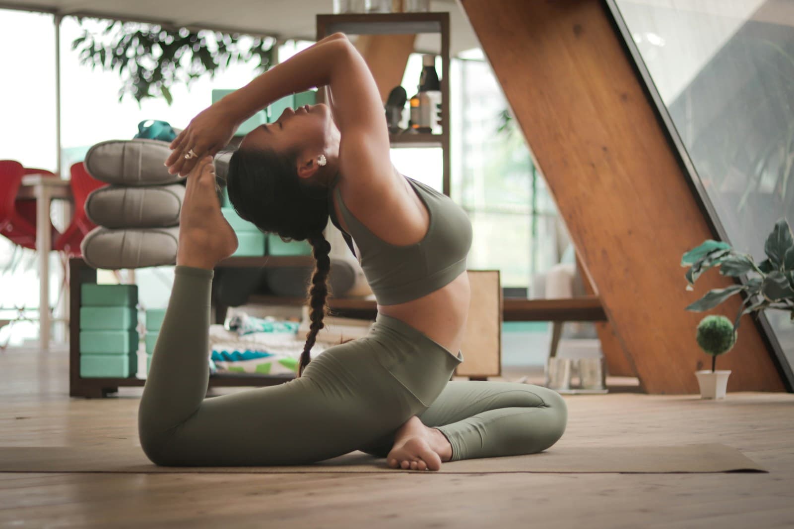 A person practising yoga in a bright studio